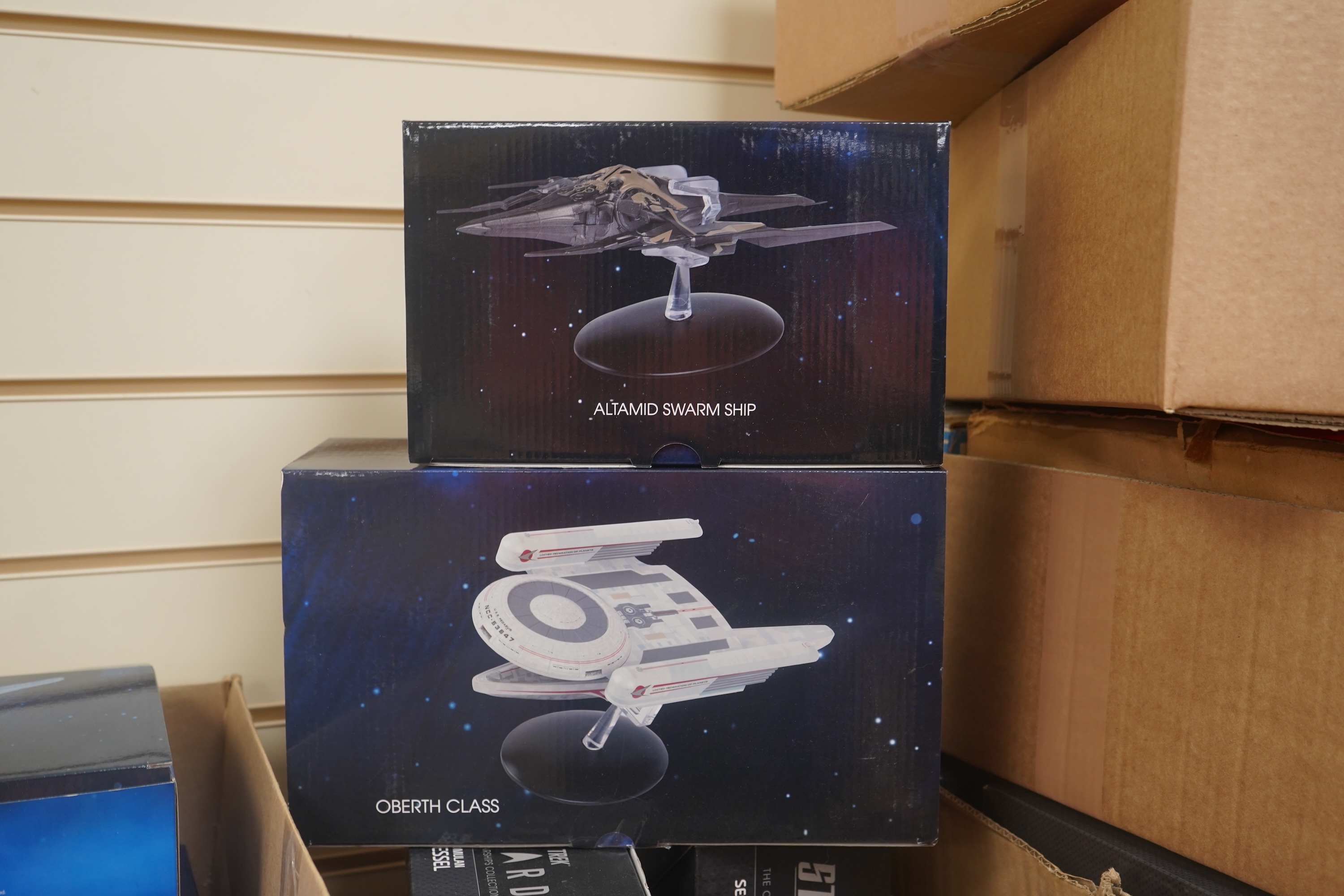 Eighteen boxed Eaglemoss Star Trek magazine issue models, including; a Vulcan Cruiser, a Klingon Qugh Class vessel, a Son’a Battleship, a Romulan Flagship, Jupiter Station, Ty’Gokor Orbital Station, etc. Condition - good